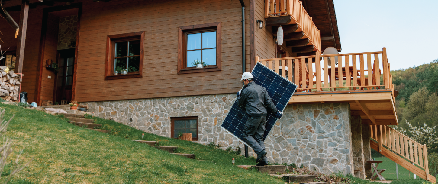 Solar installer carrying panel