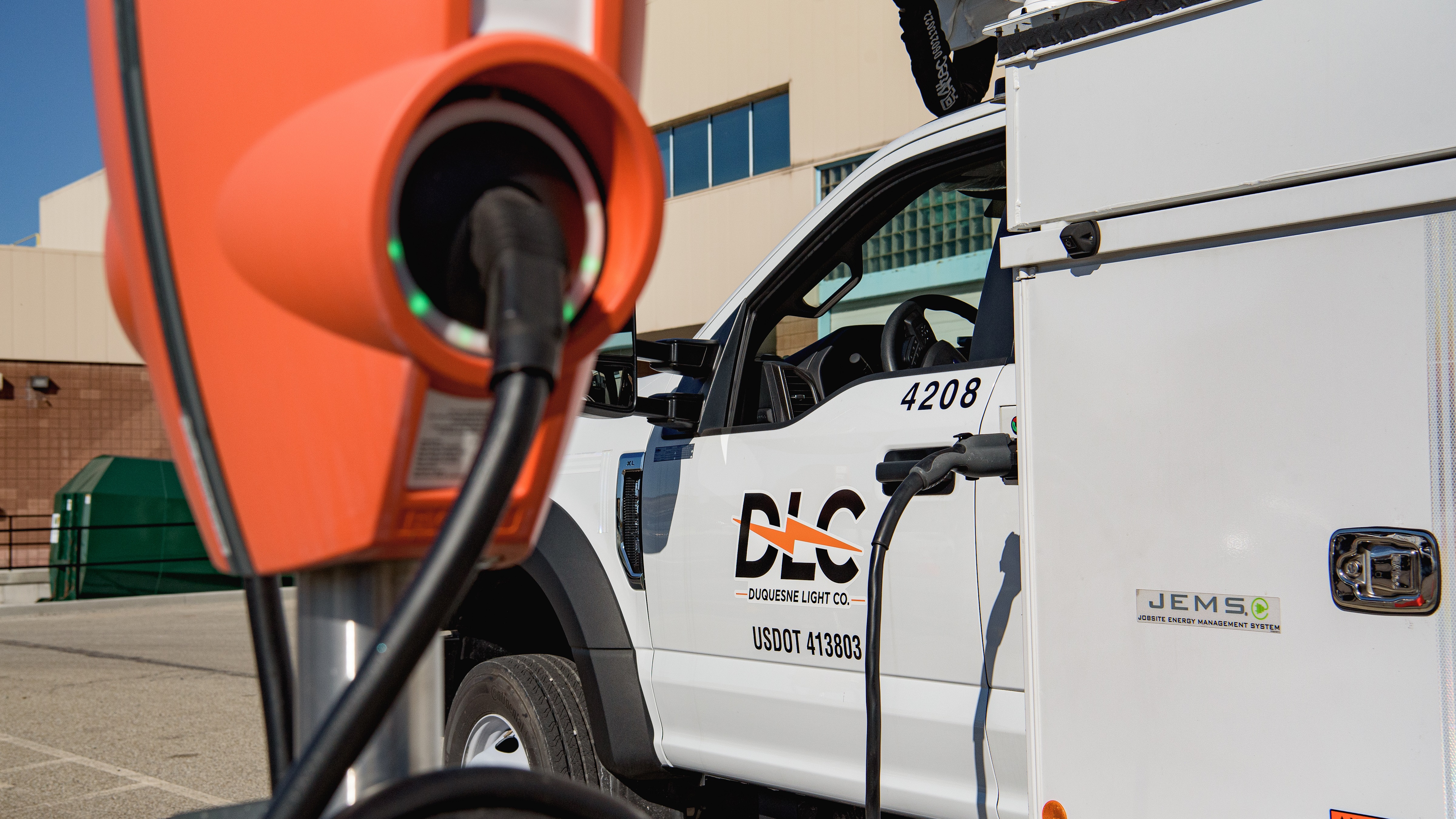 DLC truck charging at EV charging station