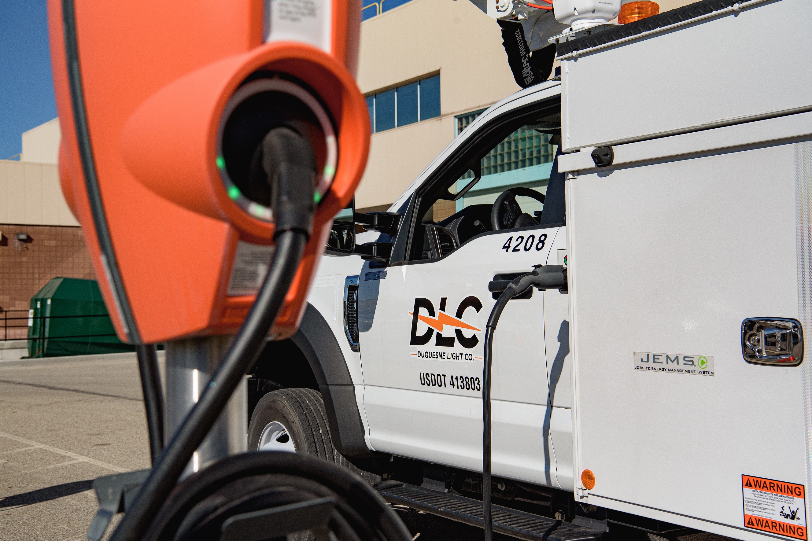 DLC truck charging at EV charging station